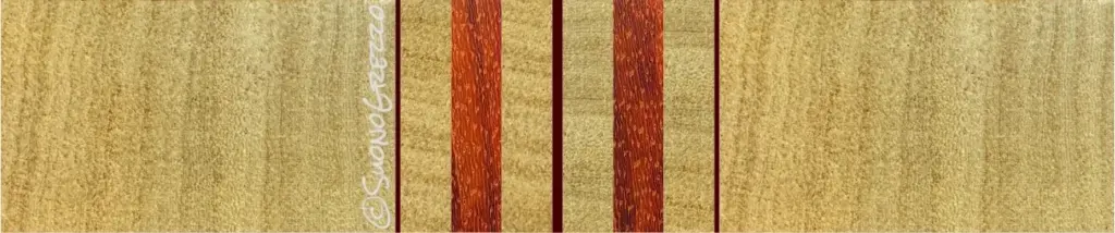 Strati di ramino, padouk e impiallacciatura di mogano alternati per la costruzione del manico laminato di un basso elettrico artigianale